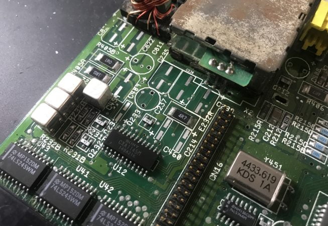 Amiga 600 mainboard with capacitors removed